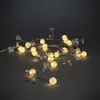A string of LED lights shaped like branches with leaves and berries. Produktbild-Vorschau