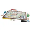 A board game with a map of North America and various colored train pieces and cards. Produktbild-Vorschau