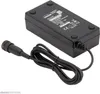 A black battery charger with a black cable and connector. Podgląd zdjęcia produktu