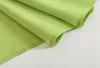 A close-up view of folded green fabric, likely a curtain or textile. Produktbild-Vorschau