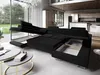 A sectional sofa is shown in a modern living room with large windows overlooking a garden. Podgląd zdjęcia produktu