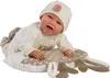 A baby doll is lying on a pillow with a deer pattern. Podgląd zdjęcia produktu