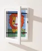 A white picture frame with a drawing of a lion inside is mounted on a white wall. Náhľad obrázku produktu