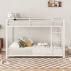 A white metal bunk bed with mattresses and pillows, set up in a room with a checkered rug. Anteprima dell’immagine prodotto