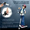 A child is shown riding an electric scooter, with instructional graphics and text overlaid on the image. Náhled obrázku produktu