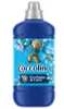 A bottle of Coccolino fabric softener with a teddy bear graphic. Podgląd zdjęcia produktu