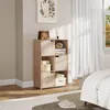A bedroom scene with a wooden storage unit filled with items, next to a window with white curtains. Produktbild-Vorschau