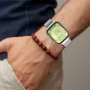 A person's arm wearing a watch and a bracelet. Náhled obrázku produktu