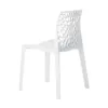 A white designer chair with a patterned backrest is shown against a white background. Produktbild-Vorschau