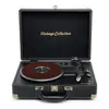 A vintage-style record player is shown with its lid open, against a white background. Voir les images du produit