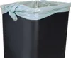 A close-up of the top of a black trash can with a light gray trash bag liner tied at the top. Produktbild-Vorschau