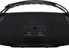 A close-up view of the back of a black portable speaker, showing its ports. Podgląd zdjęcia produktu