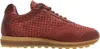 A side view of a red leather sneaker with a tan sole. Voir les images du produit