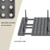 A close-up shot of a modular organization system, showcasing its interlocking parts and stabilizing feet. Produktbild-Vorschau