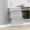 A kitchen cabinet with three open drawers next to an oven. Anteprima dell’immagine prodotto
