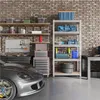 A garage or workshop setting with a car, tools, and storage shelves. Podgląd zdjęcia produktu