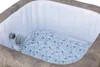 An interior view of an empty inflatable hot tub with a patterned floor mat. Produktbild-Vorschau