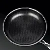 A close-up view of the interior of a frying pan with a honeycomb pattern. Náhľad obrázku produktu