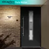 A modern anthracite front door with a glass panel and a silver handle, mounted on a brick wall. An outdoor light fixture is mounted on the wall above a small plant. Produktbild-Vorschau