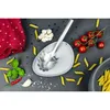 A collection of ingredients and a pasta serving utensil arranged on a dark surface. Produktbild-Vorschau
