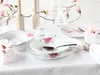 A beautifully set table with floral-themed porcelain dinnerware. Náhľad obrázku produktu