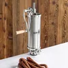 A stainless steel sausage stuffer is shown with finished sausages in front of a wooden background. Produktbild-Vorschau