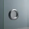 A close-up of a round, silver handle on a glass door. Produktbild-Vorschau