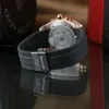 A close-up shot of a watch strap and buckle with a reflection on a dark surface. Produktbild-Vorschau