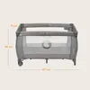 A baby crib/playpen with dimensions indicated by measurement lines and text. Produktbild-Vorschau
