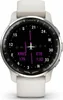 A close-up, front-facing view of a white Garmin smartwatch with a black face displaying aviation-related information. Voir les images du produit