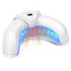 A white nail lamp with blue and red light beams emanating from it. Voir les images du produit
