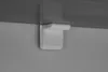 A close-up view of a white shelf bracket attached to a wall and supporting a dark shelf. Voir les images du produit