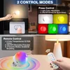 Collage showing two control modes for a light bulb: press control and remote control, with examples of different colors and features. Produktbild-Vorschau