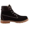 A studio shot of a black boot against a white background. Voir les images du produit