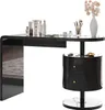 A black high-gloss vanity table with a drawer and a cylindrical cabinet with two drawers, adorned with makeup and a vase of flowers. Podgląd zdjęcia produktu