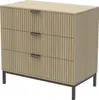 A three-drawer dresser with a ribbed wood front and black metal legs, shown against a white background. Náhled obrázku produktu