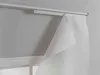 A close-up view of a white curtain hanging from a white curtain rod, partially pulled back to reveal the wall behind it. Produktbild-Vorschau