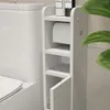 A white toilet paper cabinet next to a toilet. Produktbild-Vorschau