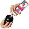 A person is filling a black KONG dog toy with peanut butter flavored treat from a spray can. Anteprima dell’immagine prodotto