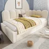 A child's bedroom with a bed, blankets, and toys. Voir les images du produit