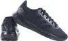 A pair of black Adidas sneakers shown from a diagonal angle against a white background. Podgląd zdjęcia produktu