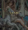A woman on a carousel with a perfume bottle. Anteprima dell’immagine prodotto
