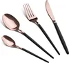 A set of four rose gold and black cutlery items arranged diagonally on a white background. Anteprima dell’immagine prodotto