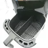 Interior view of an open air fryer basket with a divider. Voir les images du produit