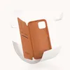 A brown leather flip case for a smartphone is shown open, revealing the interior. Podgląd zdjęcia produktu