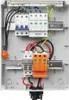 An electrical enclosure with various components, including circuit breakers and surge protectors, wired together. Náhled obrázku produktu