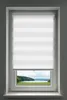 A white roller blind with horizontal stripes is installed on a window. The bottom part of the window shows a landscape view of a lake and trees.