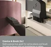 A split image showing a vacuum cleaner attachment cleaning a lampshade on the left and a bookshelf on the right. Produktbild-Vorschau