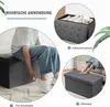 A collage of images showing a dark gray storage ottoman in different uses: as a shoe bench, a storage box, and a footrest. A person is shown sitting on it and another person's feet are on it. Anteprima dell’immagine prodotto