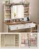 A vanity table with a mirror, drawers, and storage compartments, along with close-ups of jewelry and makeup organizers. Produktbild-Vorschau